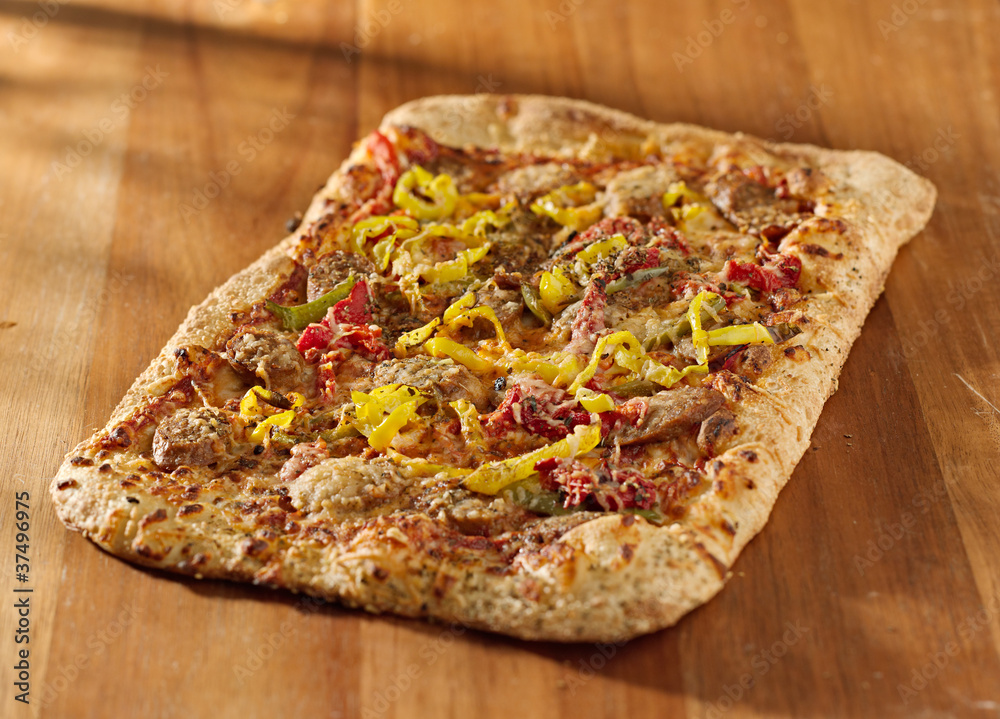 gourmet pizza with sausage and colorful peppers gourmet pizza with sausage and colorful peppers