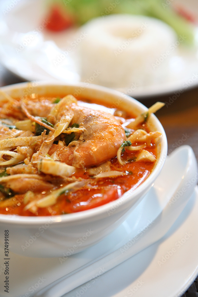 Tom Yum soup , a Thai traditional spicy prawn soup with rice Tom Yum soup , a Thai traditional spicy prawn soup with rice