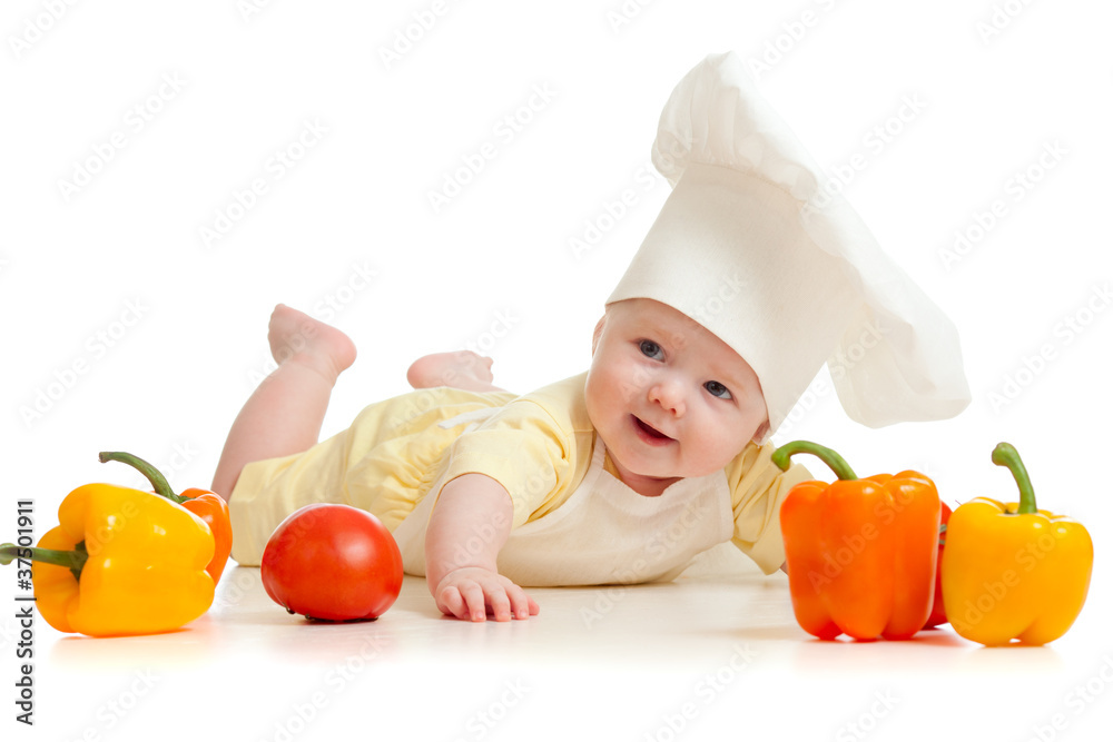 Portrait of a baby wearing a chef hat with healthy food vegetab Portrait of a baby wearing a chef hat with healthy food vegetab