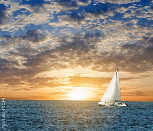 yacht in a sea at the evening