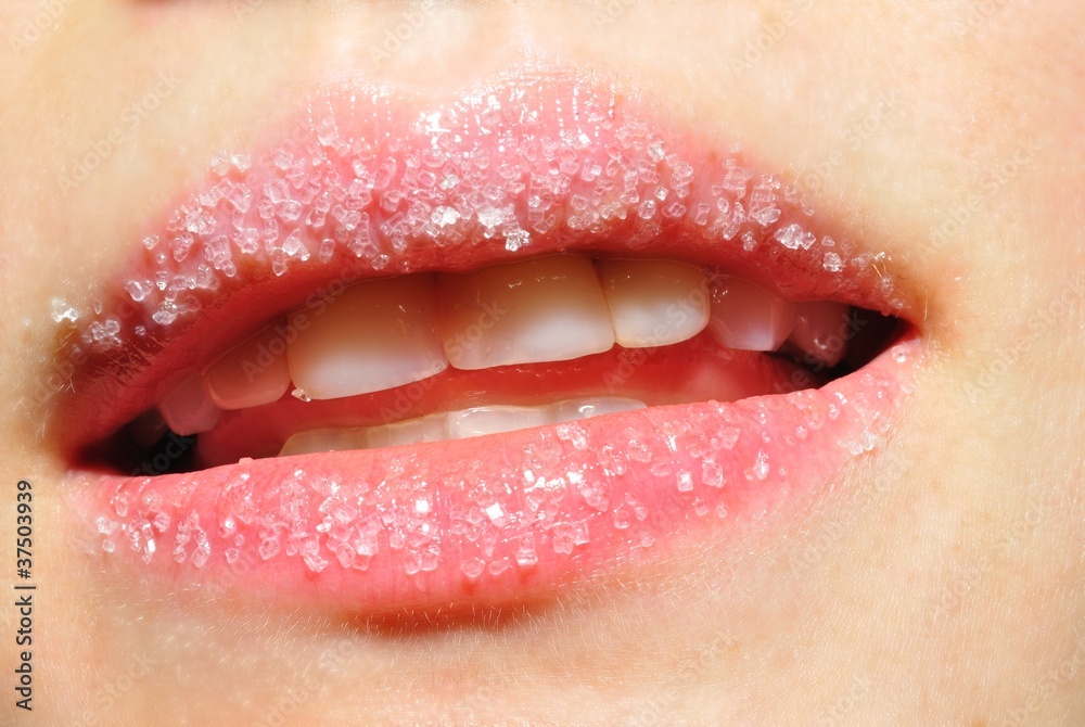 Obraz premium Close up macro of young woman's sweet lips