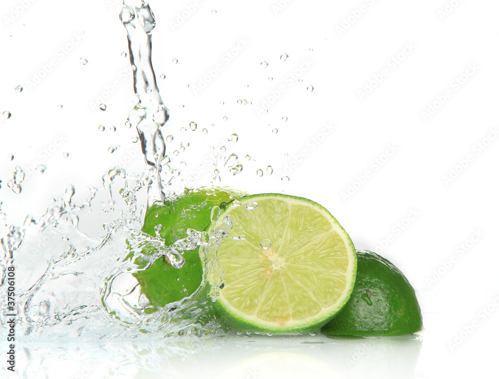 Green limes with splashing water Green limes with splashing water