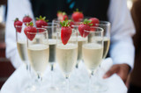 Waiter Serves Champagne on Tray