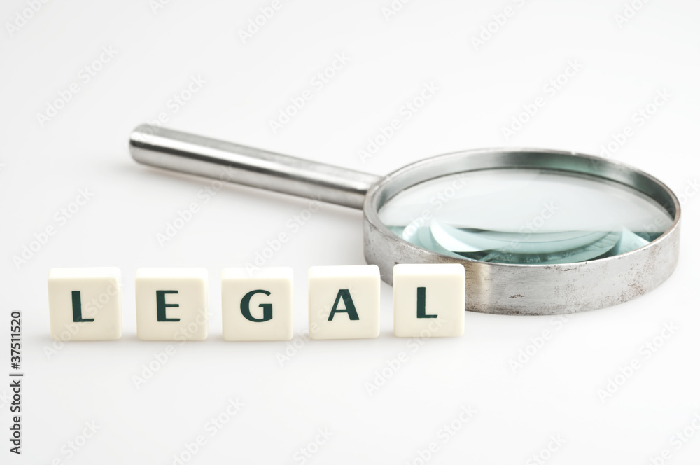 Legal word and magnifying glass Legal word and magnifying glass