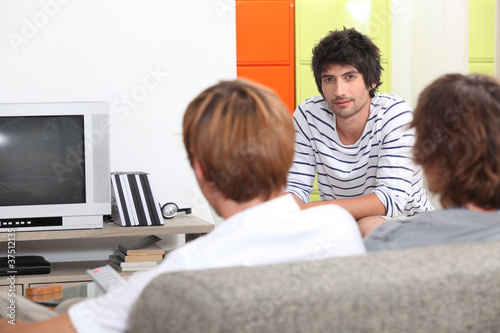 Men watching television