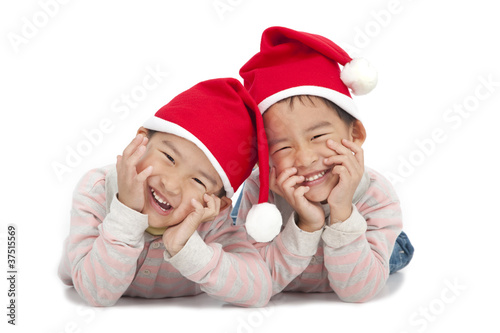 Christmas kids in Santa hat isolated on white