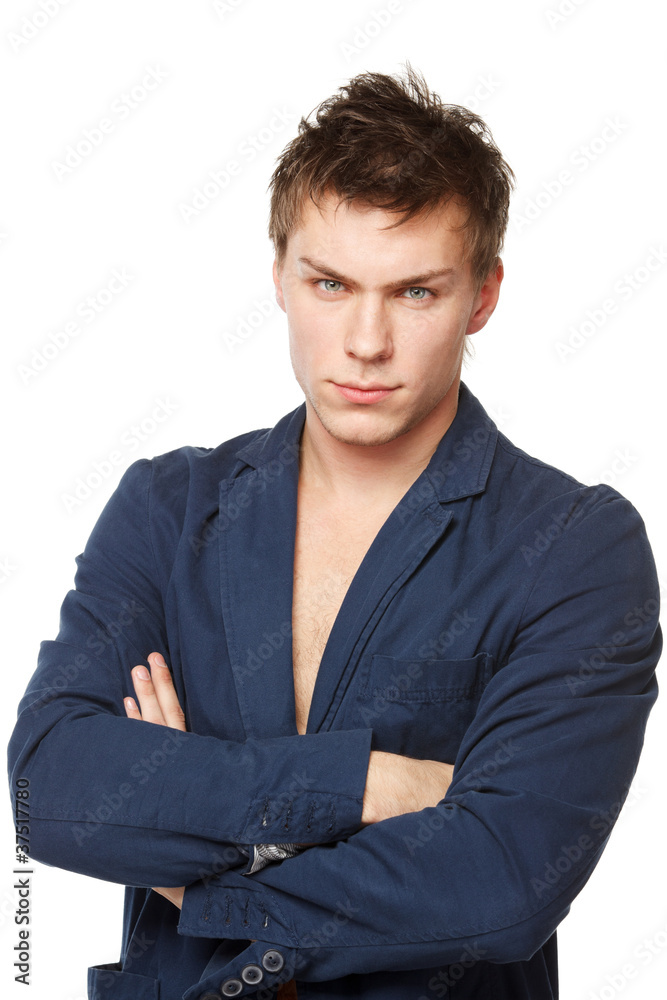 Portrait of young male standing with folded hands Portrait of young male standing with folded hands