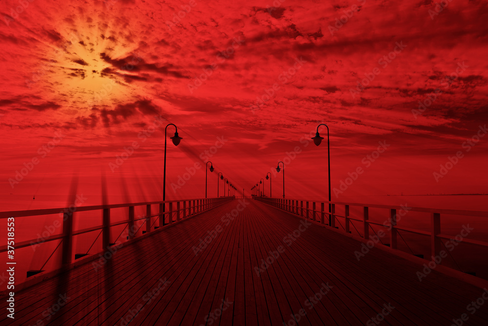 Fototapeta premium Sunrise at the pier in Orlowo, Poland.