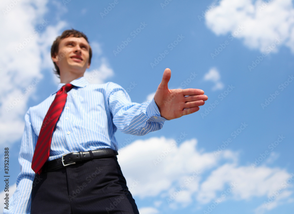 young businessman in a blue shirt and red tie young businessman in a blue shirt and red tie