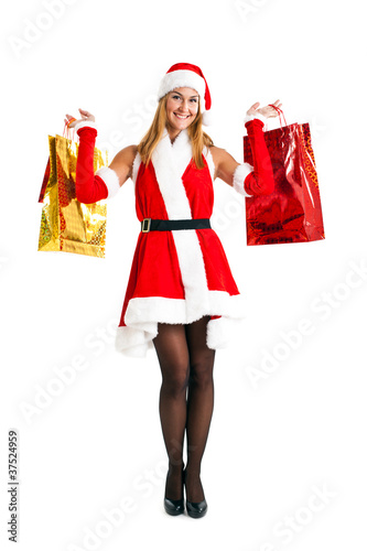 Full length Santa woman holding gifts