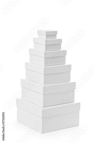 Stack of pasteboard square gift boxes