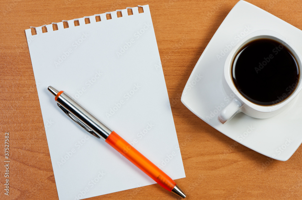 Worksheet with pen and coffee on table. Worksheet with pen and coffee on table.
