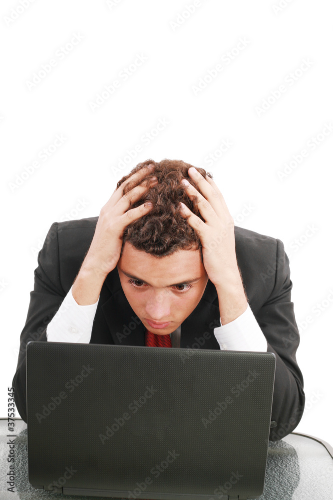 Young caucasian worried businessman with a laptop Young caucasian worried businessman with a laptop