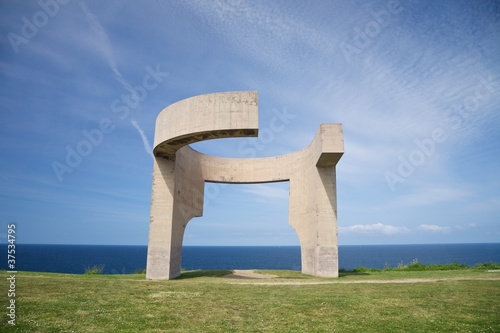 cement monument over Gijon coast photo