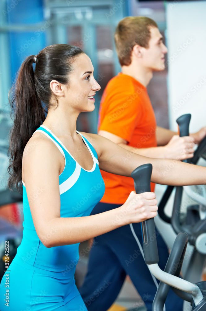 Happy woman with at training gym