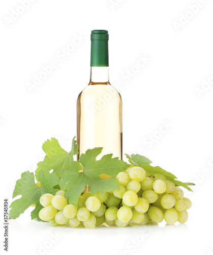 White wine bottle and grapes