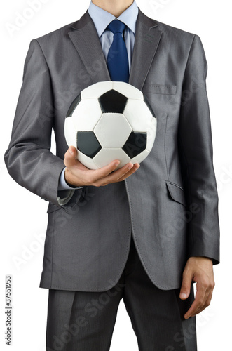 Businessman holding football on white