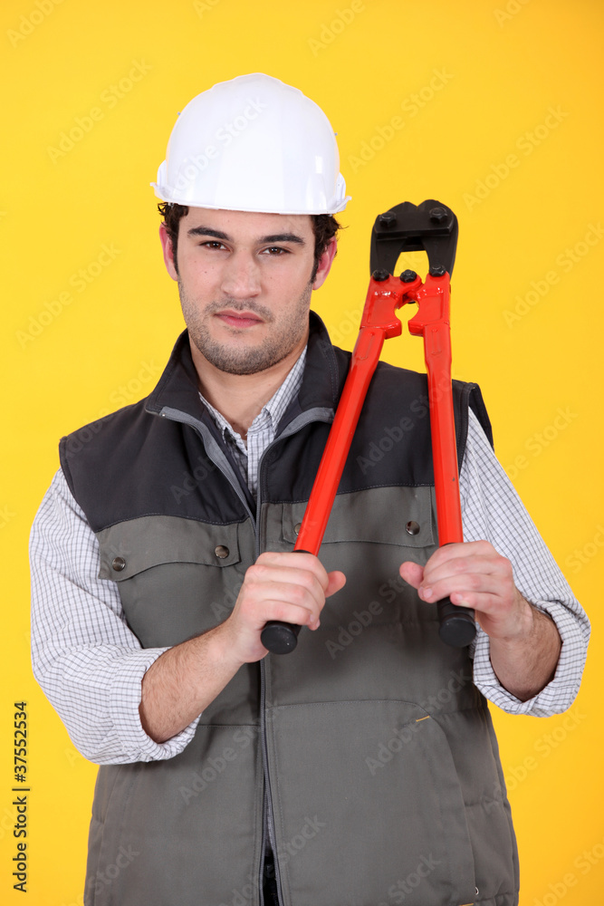 Man with pair of bolt cutters Man with pair of bolt cutters