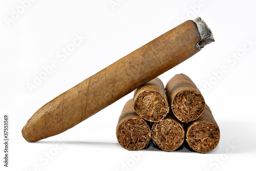 brown cigar burned on white background photo