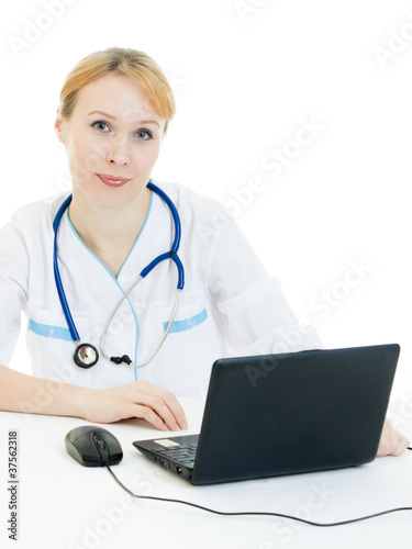 A woman doctor consultant with a laptop on a white background.
