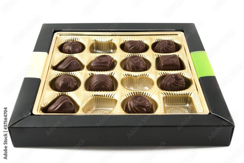 Half eaten box of chocolates over white Half eaten box of chocolates over white