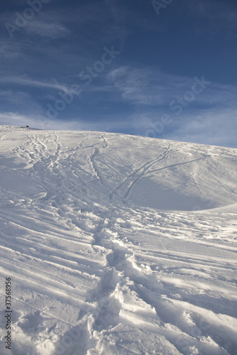 traces of skiers on the snow