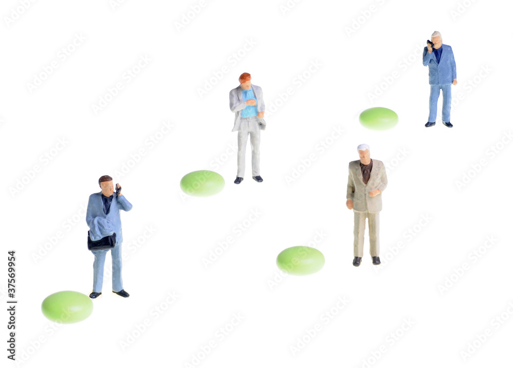 small businessmen figures, each stands next to single green pill small businessmen figures, each stands next to single green pill