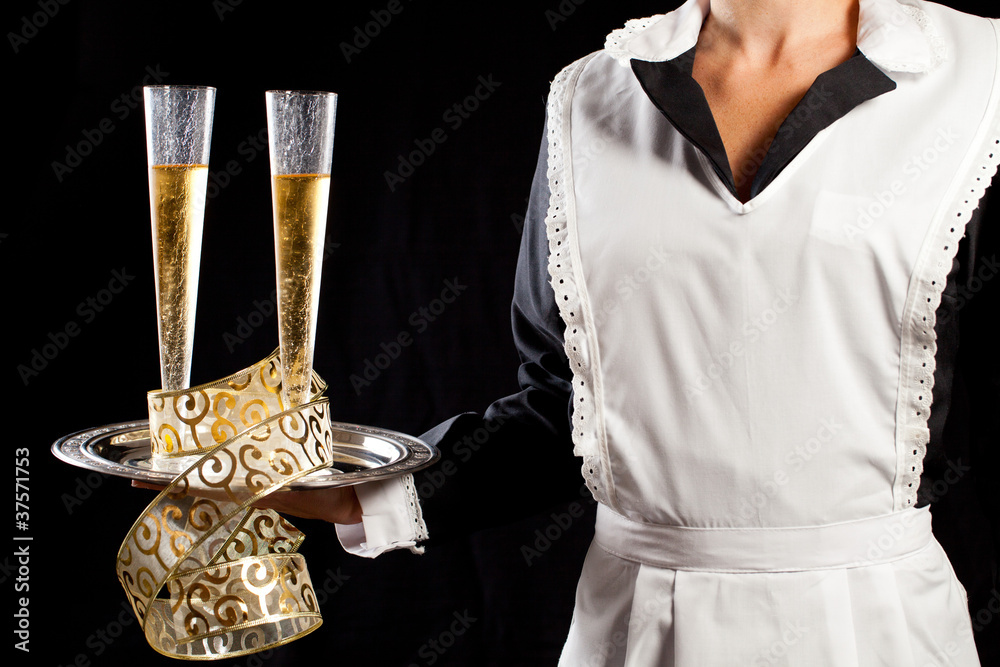 Young maid serving champagne