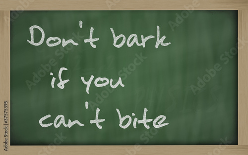 " Don't bark if you can't bite " written on a blackboard