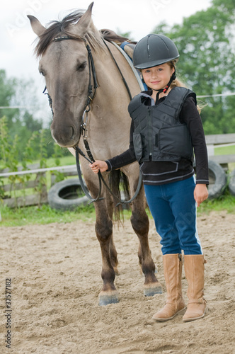 Little jockey - girl and horse ranch