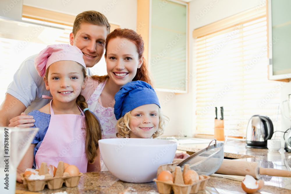 Cheerful family preparing dough Cheerful family preparing dough