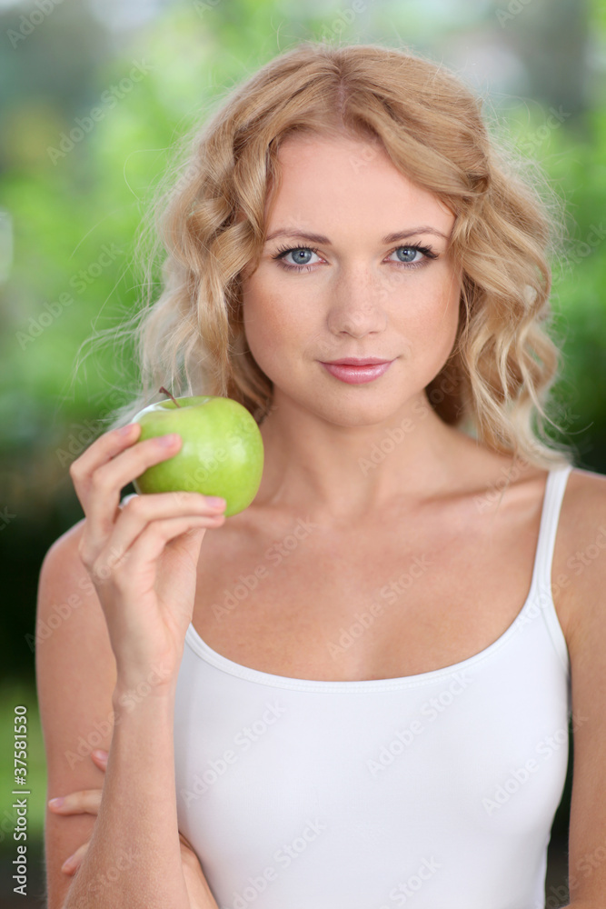 Portrait of beautiful woman eating green apple Portrait of beautiful woman eating green apple