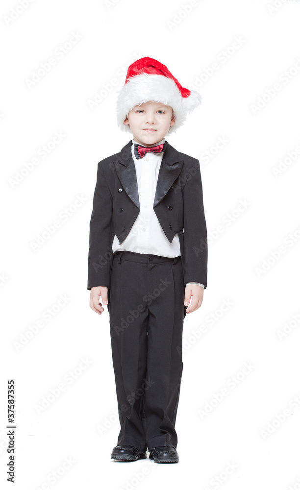 boy in a tuxedo and a cap Santa Claus on a white background boy in a tuxedo and a cap Santa Claus on a white background