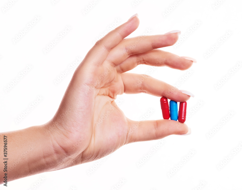 hand with pills hand with pills