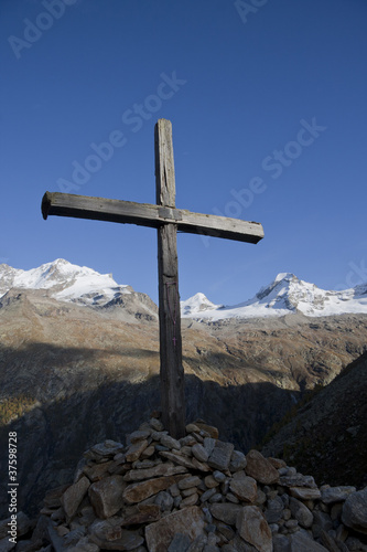Alpine landscape with wooden cross
