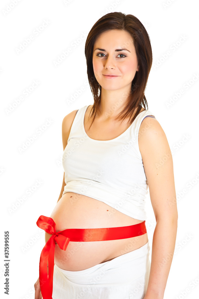Brunette pregnant woman with red ribbon isolated on white Brunette pregnant woman with red ribbon isolated on white