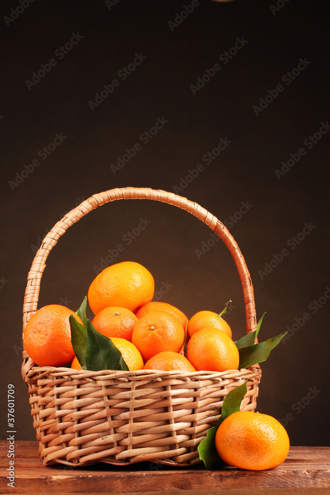 tangerines with leaves in a beautiful basket tangerines with leaves in a beautiful basket