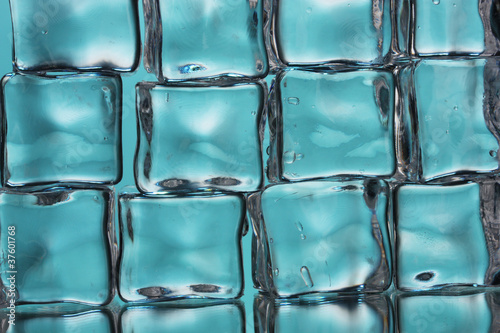 Ice cubes on blue closeup