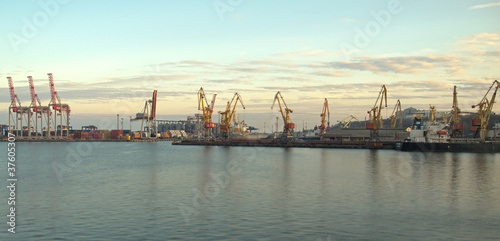 Cranes and containers at a port © toluk