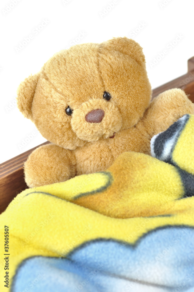 Teddy bear in a wooden drawer