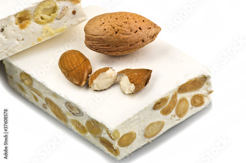 Nougat with almonds on the white