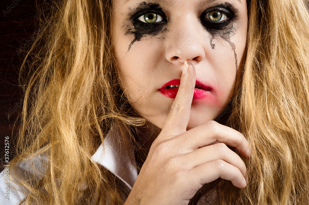 Naklejka premium Silence, showed by a sad girl