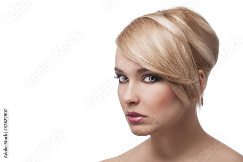 blond young girl with stylish, her face is turned three-quarters