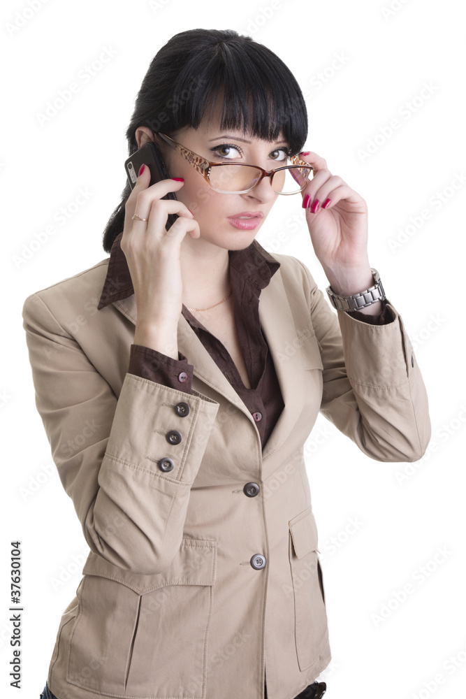 Business woman talking over cell phone Business woman talking over cell phone