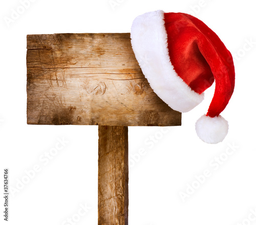 Wooden sign with Santa hat isolated on white