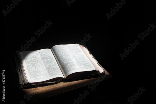 Open bible lying on a table