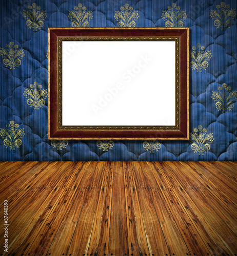 old style vintage golden frame on blue stitched textile decorate