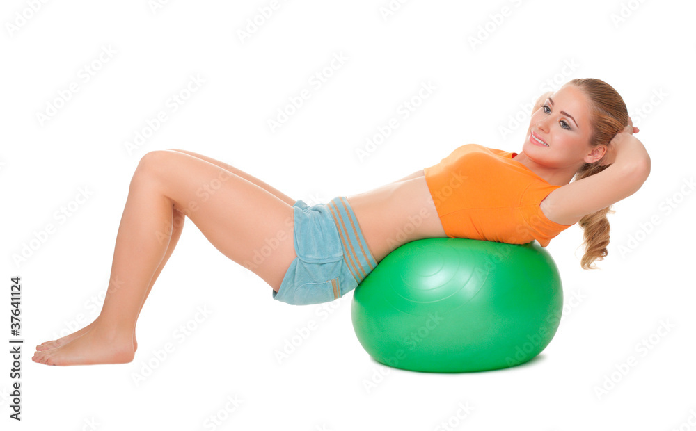 Fototapeta premium Young smiling woman on ball