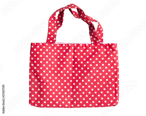 Red fabric reusable shopping bag isolate on white background