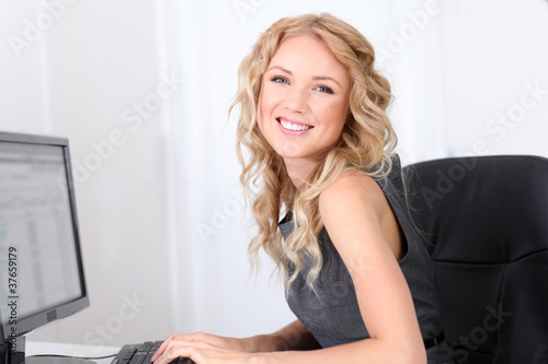 Smiling businesswoman at work in ofice